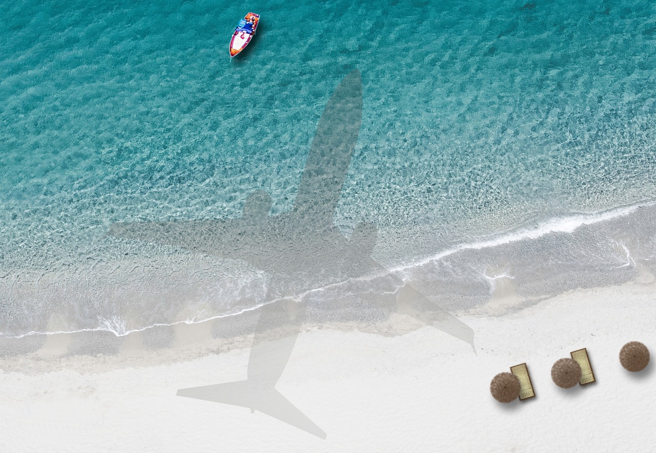 Th shadow of a plane over an Anguilla beach